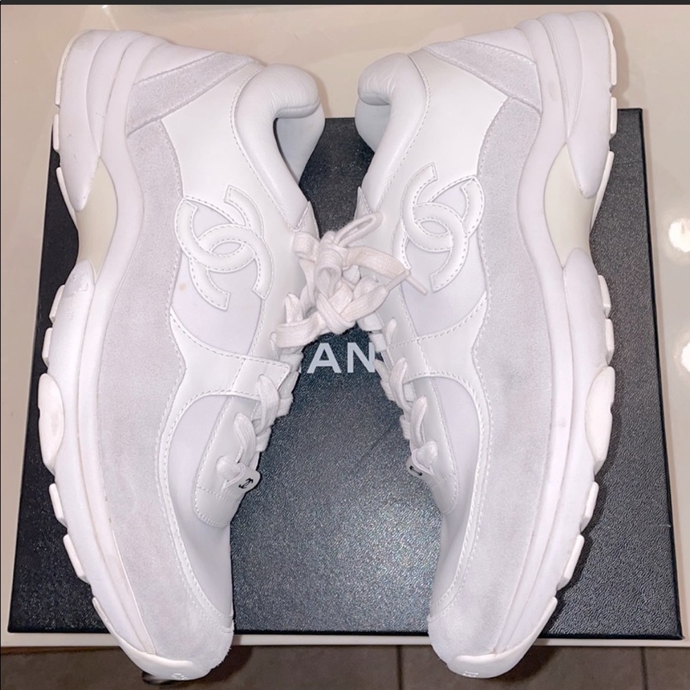 All white Chanel sneakers